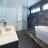 Luxury bathroom with platform bath and shower, by Avid Carpentry + Construction